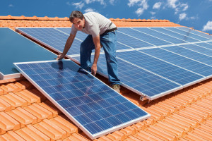 Man Installing Solar Panels